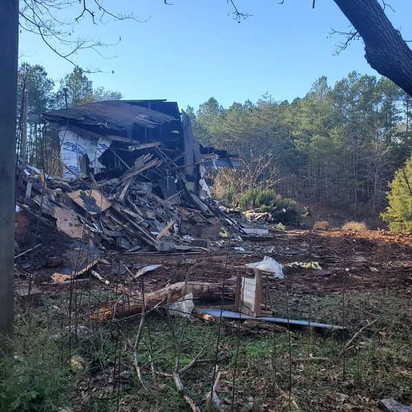 Burnt-out structure collapsed and ready for removal