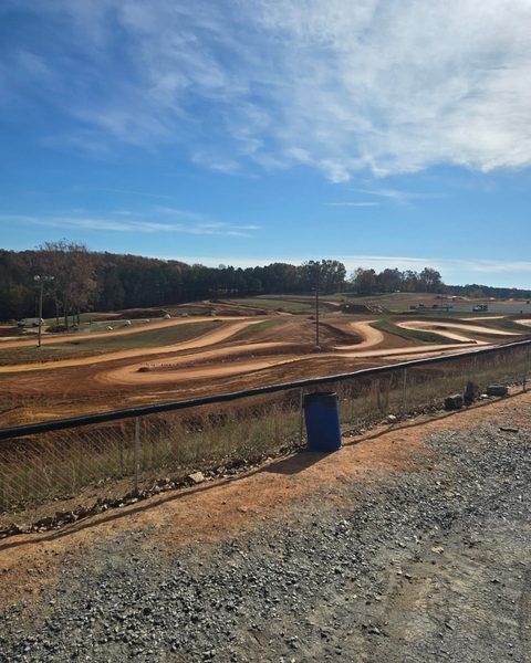 Banked dirt circuit shaped and graded across an open site