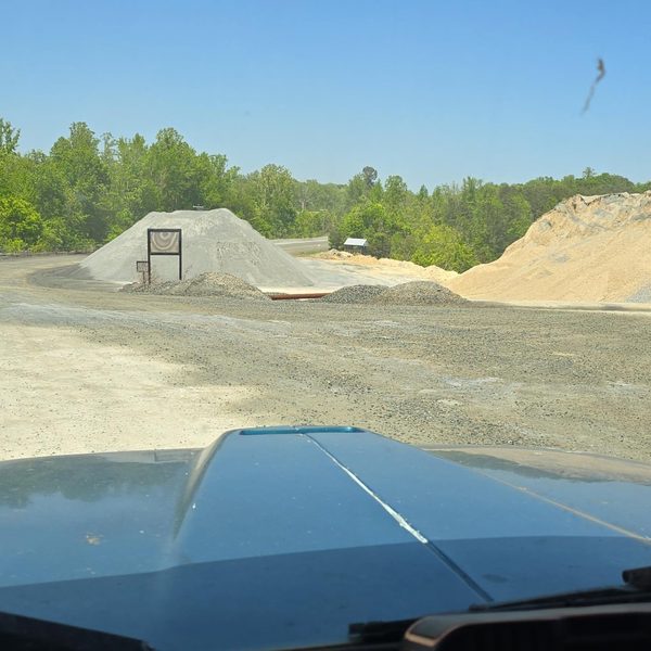Stone and sand stockpiles at the quarry