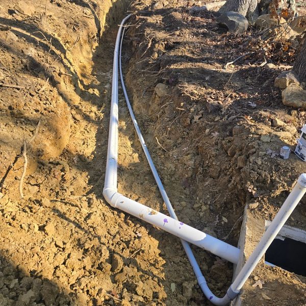 PVC lateral lines laid out in a trench and joined at a wye