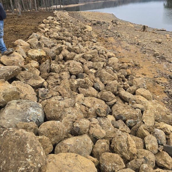 Riprap boulders armouring a shoreline against wave erosion
