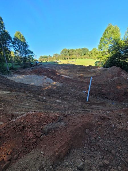 Pond basin dug out with the overflow standpipe set