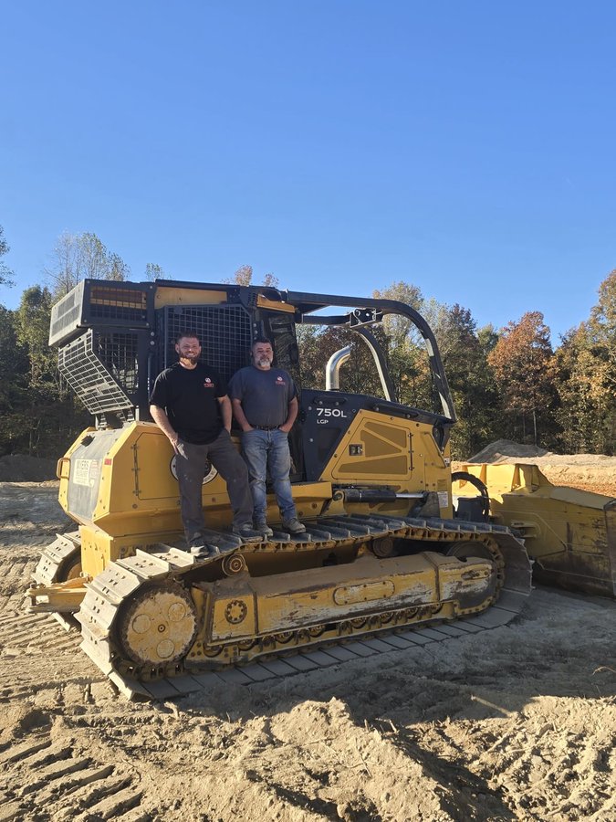 Snead's Outdoor Services crew on a dozer at a job site